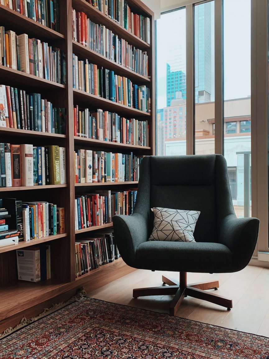 Chair in front of shelves full of books